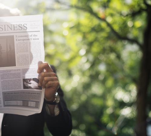 Person Reading Newspaper