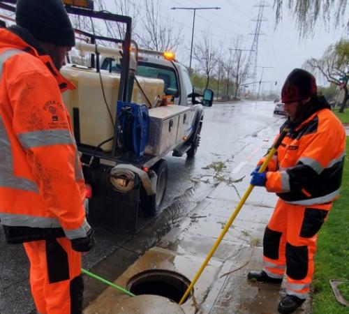 crew members working on storm drain