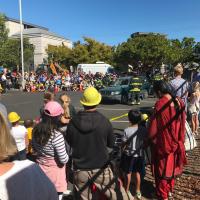 Crowd watches SMCFD firefighters demonstrate using the "jaws of life" to rescue a trapped victim