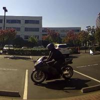 Robbery Suspect Leaving on Motorcycle