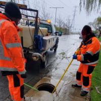 crew members working on storm drain