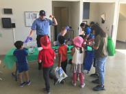 SMCFD Firefighter cadets talk with children and their parents about fire safety