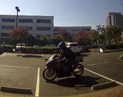 Robbery Suspect Leaving on Motorcycle