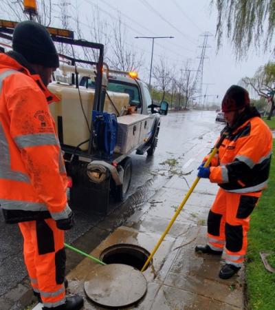 crew members working on storm drain